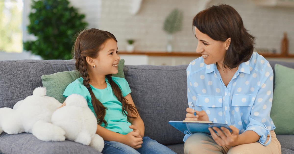 Young girl receiving social support from a professional