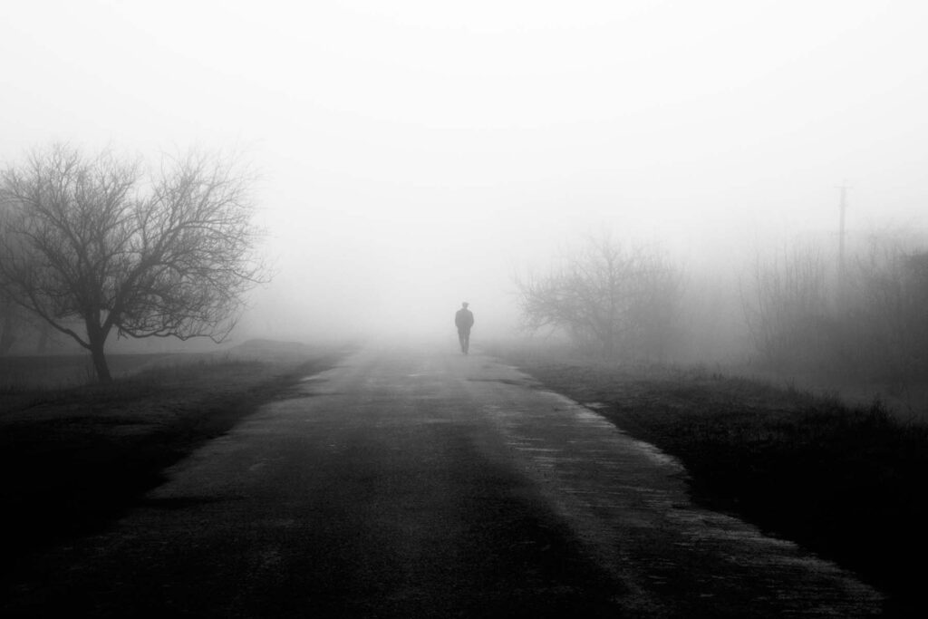 silhouette in fog loneliness concept