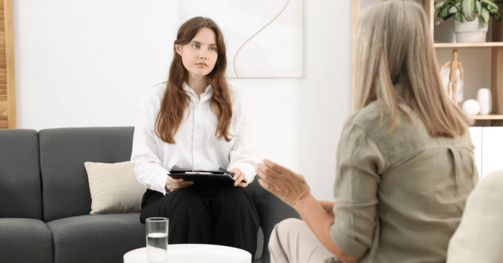 A therapist actively listening to her client
