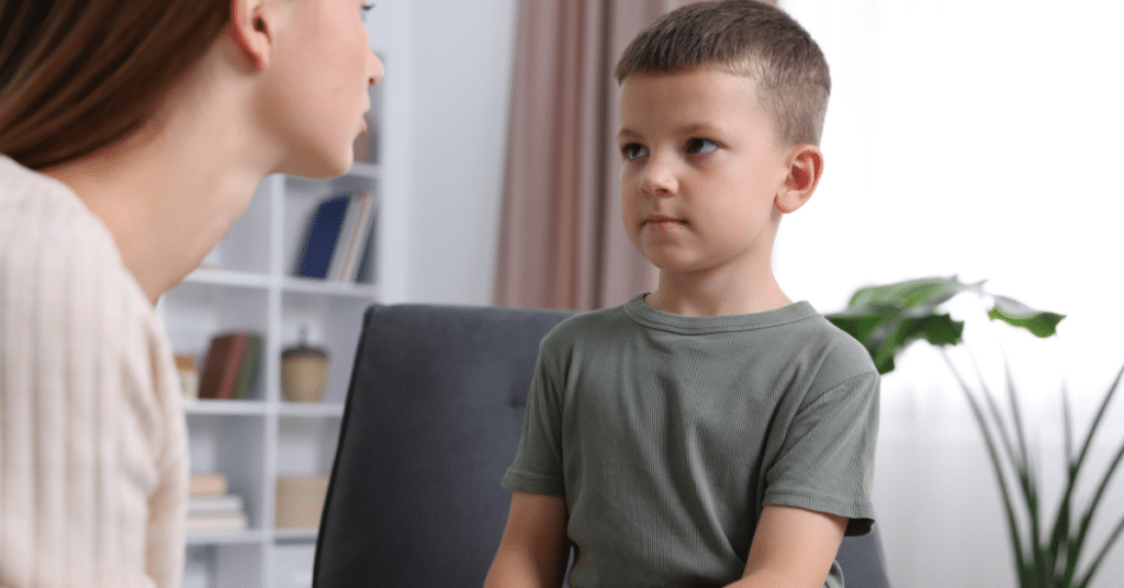 A mother having a discussion with her young son