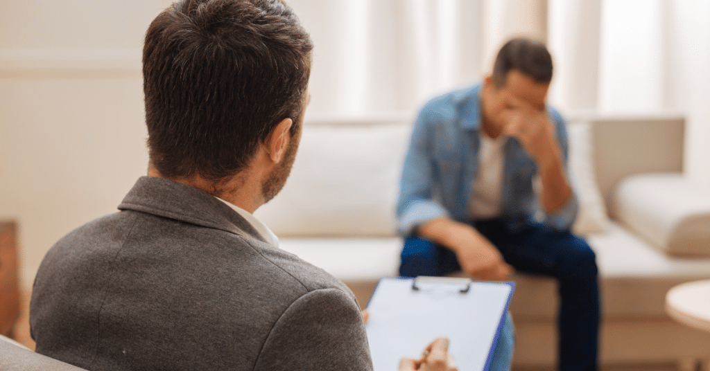 Therapist listening to his client